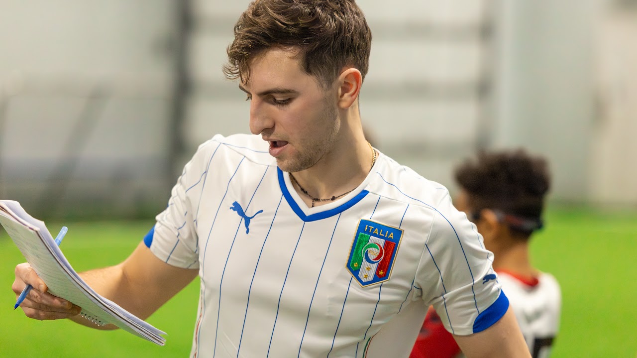 Coach working with players